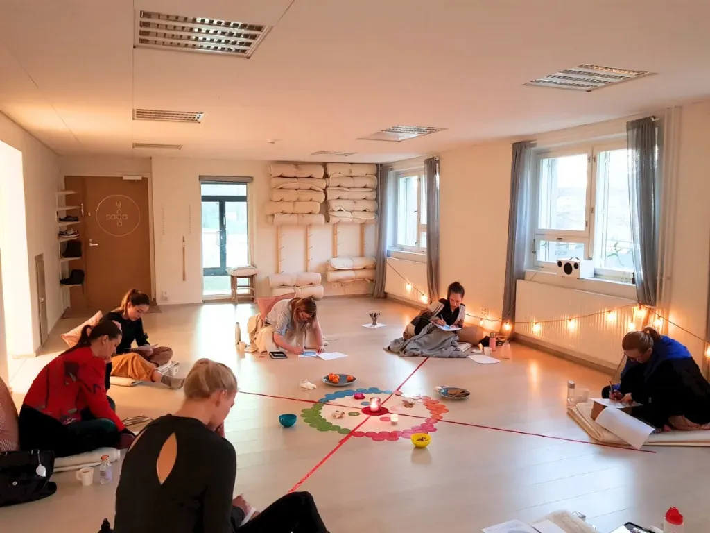 Women gathered in circle for in-person workshop in Helsinki
